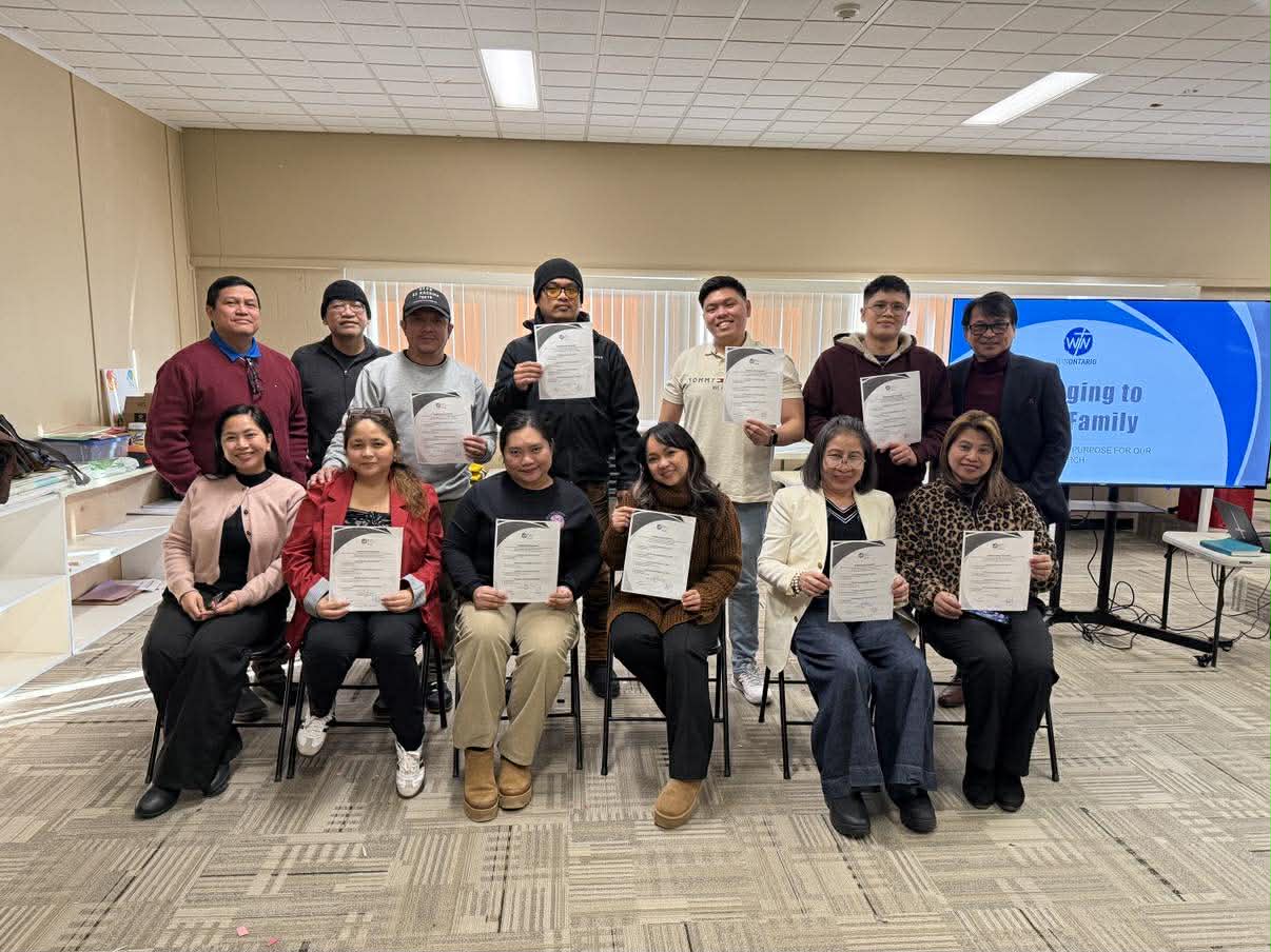 Members holding biblical literature and study materials